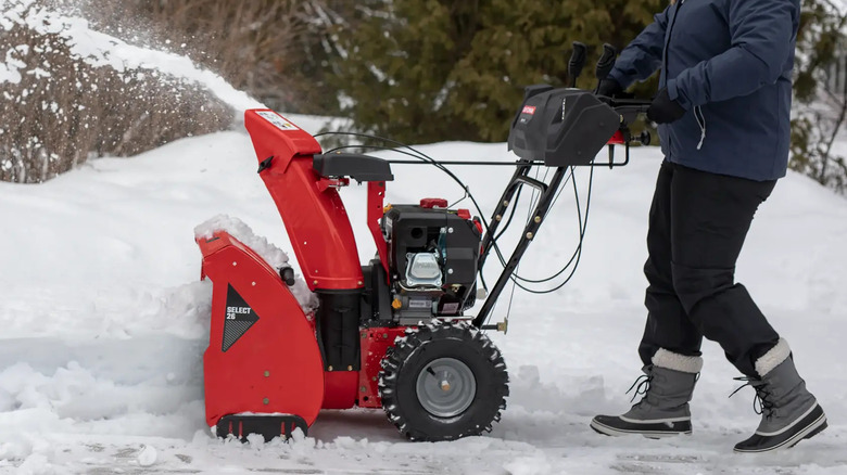 the CRAFTSMAN 26-inch 243cc Two Stage Gas Snow Blower in action