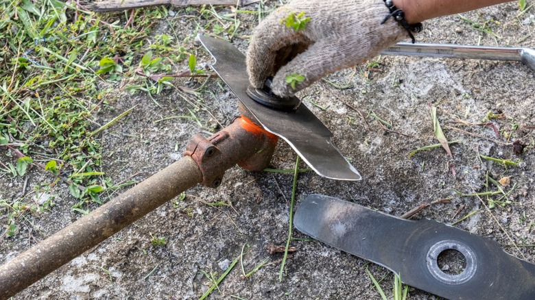 Replacing an edger blade.