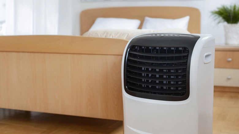 Close-up of portable air conditioner unit in bedroom.