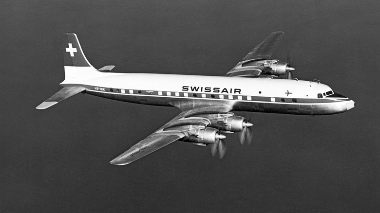 A Swissair DC-7 flyig over the California coast in the late 1950s