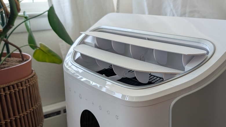 Dreo air conditioner near plant.