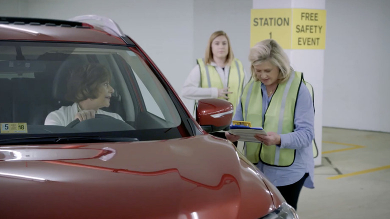 CarFit volunteer educating an older driver.
