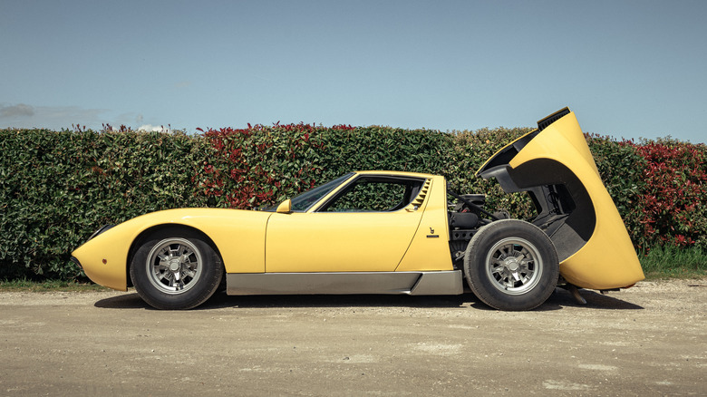 A Lamborghini Miura with the engine cover open.