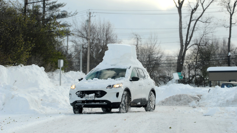 now remains on top of a car after an intense lake-effect snowstorm that impacted the area on November 20, 2022 in Hamburg, New York.