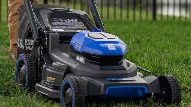 A Kobalt lawn mower on grass.