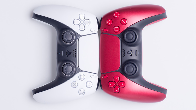 Sony DualSense controllers in white and pink