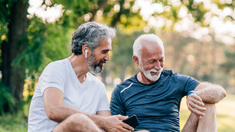 Man wearing earbuds while outdoors