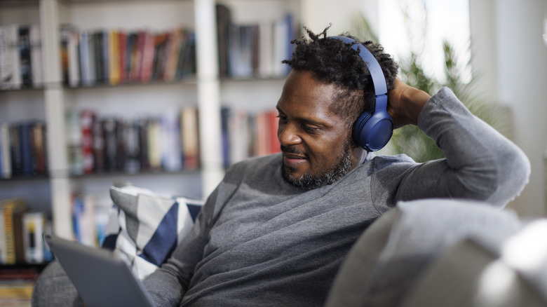 man with blue headphones