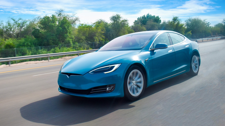 A Tesla car in blue.