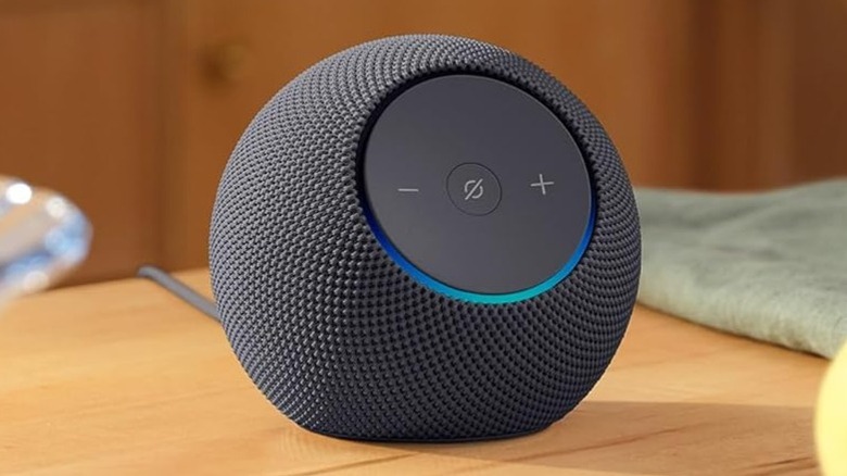 Amazon Echo Dot Max on a wood table next to a green cloth