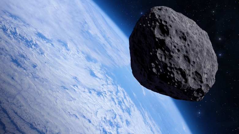 Digital image of an asteroid above the planet.