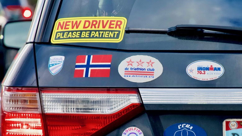 Rear view of a car with several stickers on it