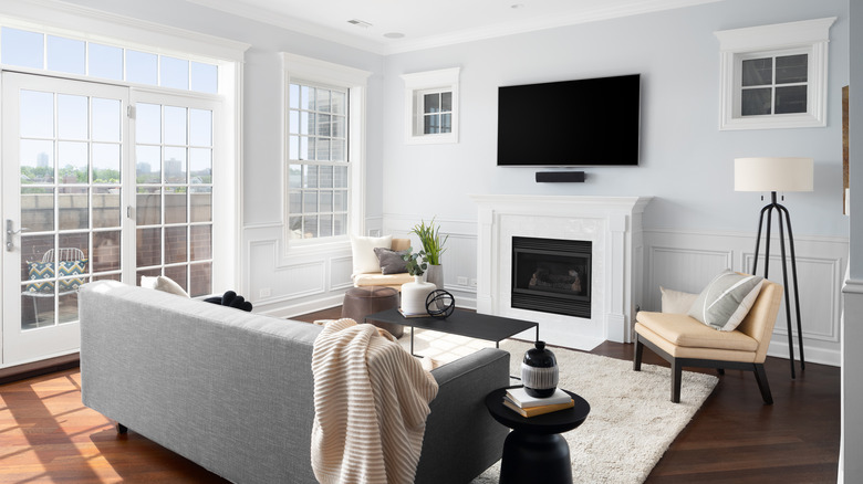 a cozy living room with a mounted TV