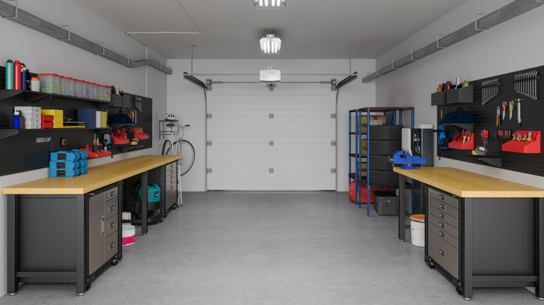 An organized garage with slat walls
