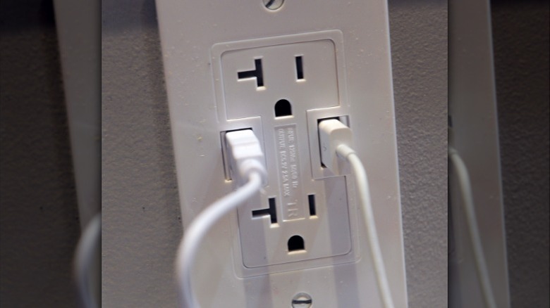 Wall outlet with USB ports and outlet with T-shaped hole