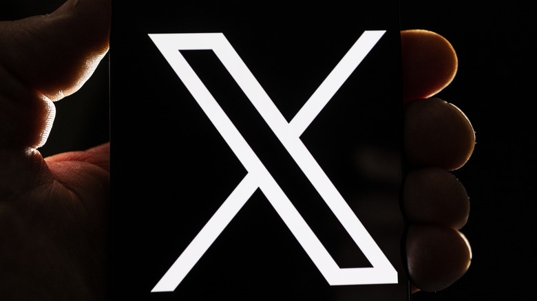 X logo smartphone screen