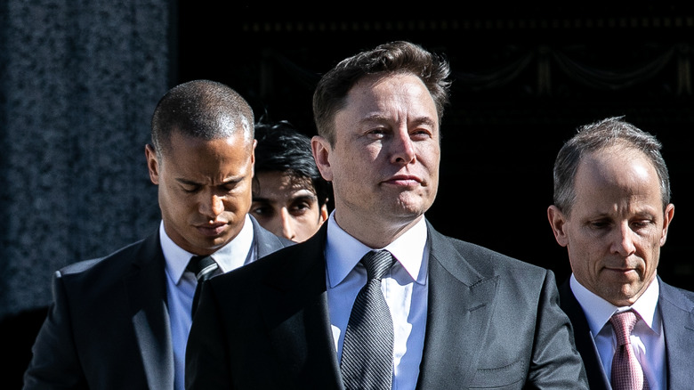 Elon Musk standing outside courthouse