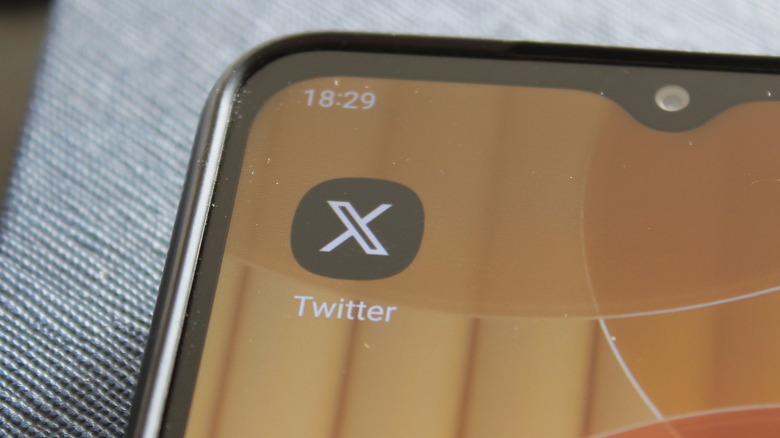 x app logo smartphone