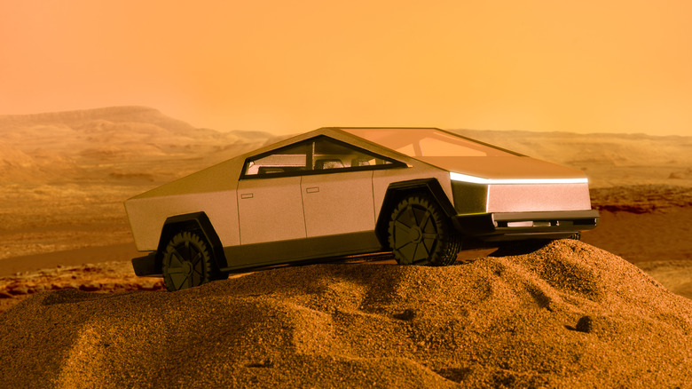 A Tesla Cybertruck in desert-like surroundings.