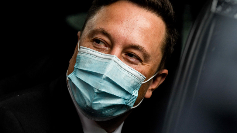 Elon musk in a surgical mask