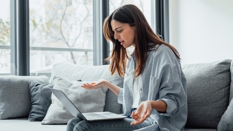 Woman frustrated at her laptop