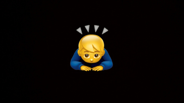 Person bending forward in a deep bow