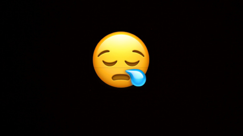 Face with closed eyes and a snot bubble