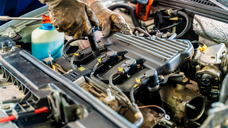 mechanic working on engine