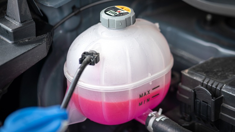Purple coolant overflow bottle