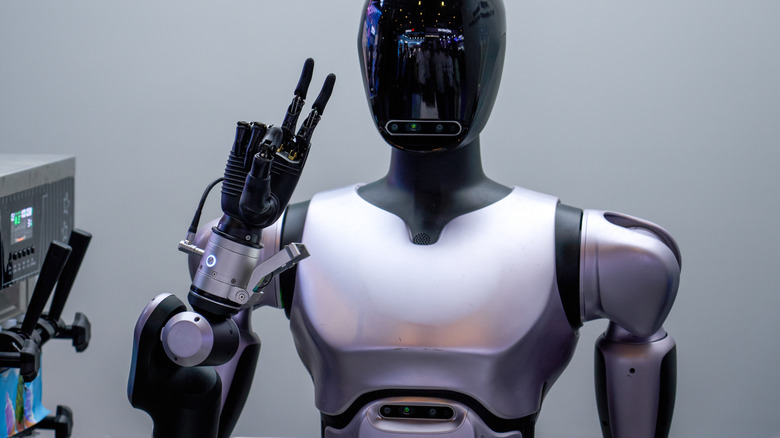 Robot giving peace sign.