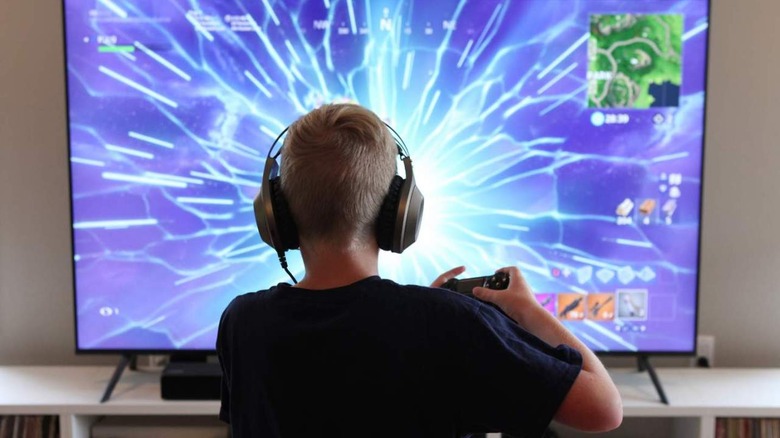 Boy playing Fortnite on PlayStation