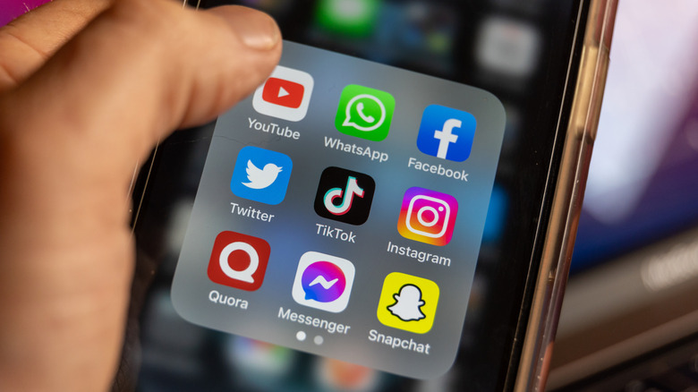 An iPhone with popular apps on screen