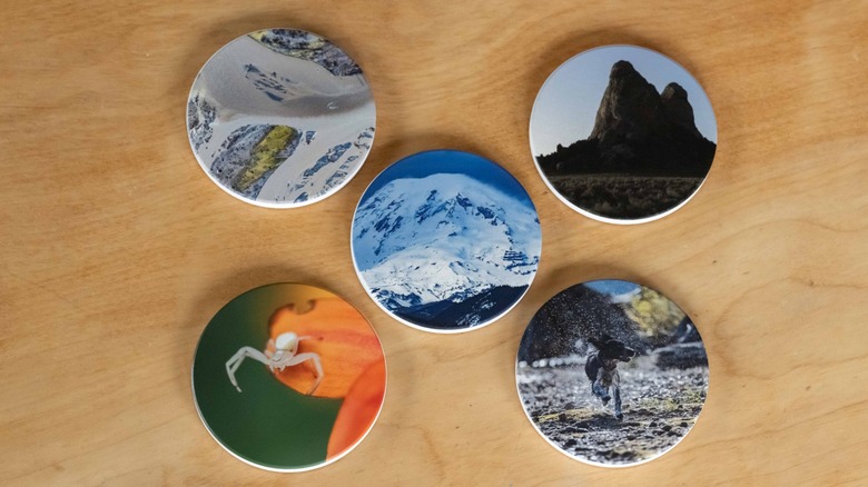 Five coasters with photographs printed on them.