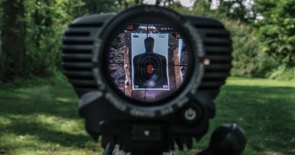 A view through the scope of the Tracking Point TP750 shows the white dot which can be set so the rifle doesn't fire until it is in the crosshairs again.