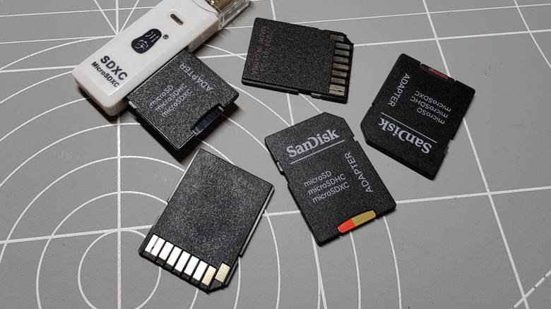 A collection of SD cards and an SD card reader