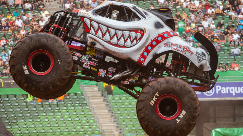 A monster truck flying through the air
