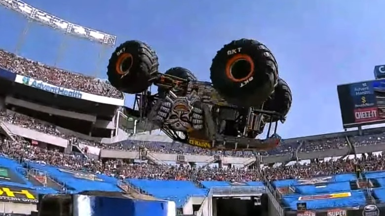A monster truck in the middle of a flip
