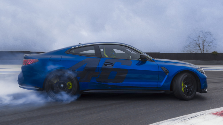 Side view of BMW M4 CS Edition VR46 cornering on race track