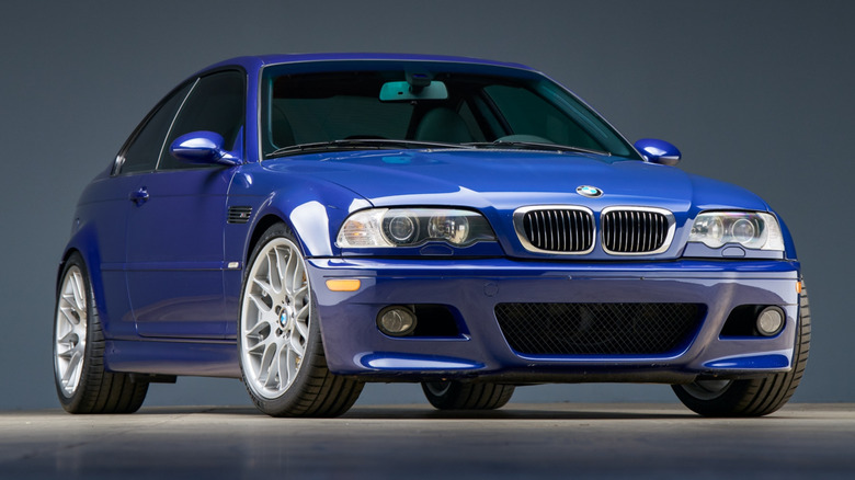 Blue BMW E46 M3 on showroom floor