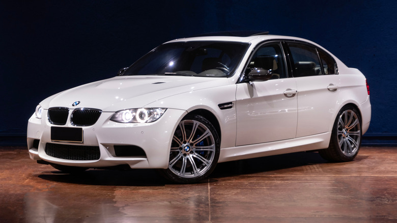 White BMW E90 M3 on showroom floor