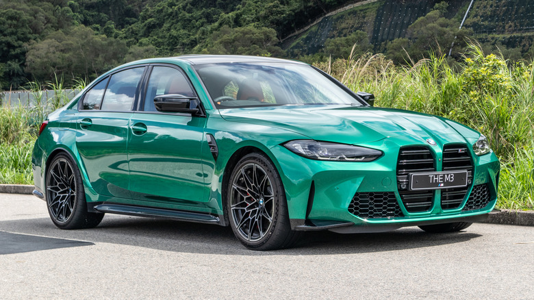 Green BMW G80 M3 outside