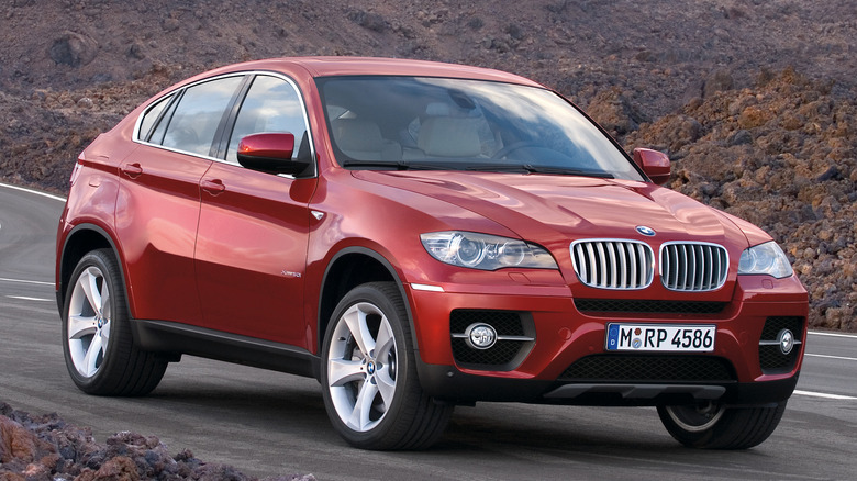 Red 2008 BMW X6 parked on a road