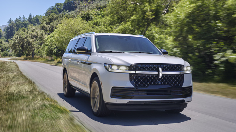 Lincoln Navigator L driving down a country road