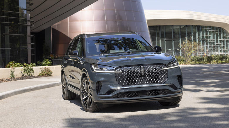 Lincoln Aviator parked in front of a modern building
