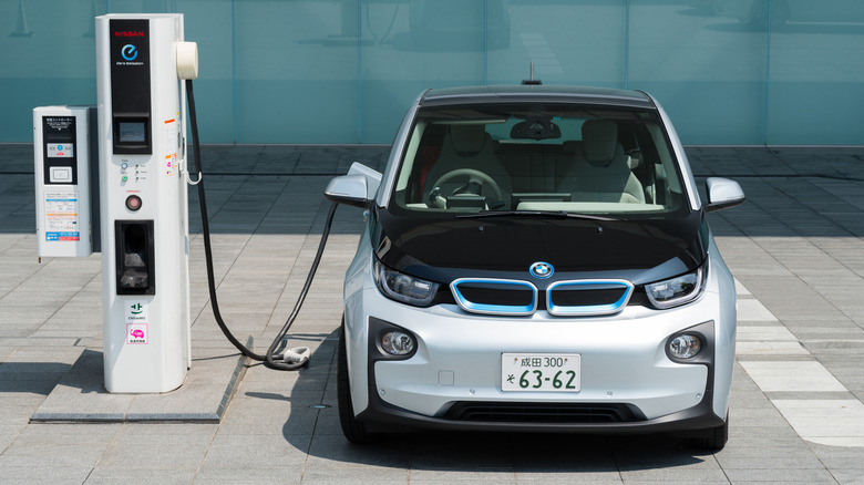 A BMW i3 connected to a charger