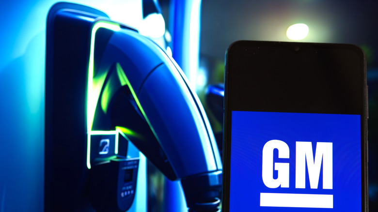 GM logo next to an EV charging bay