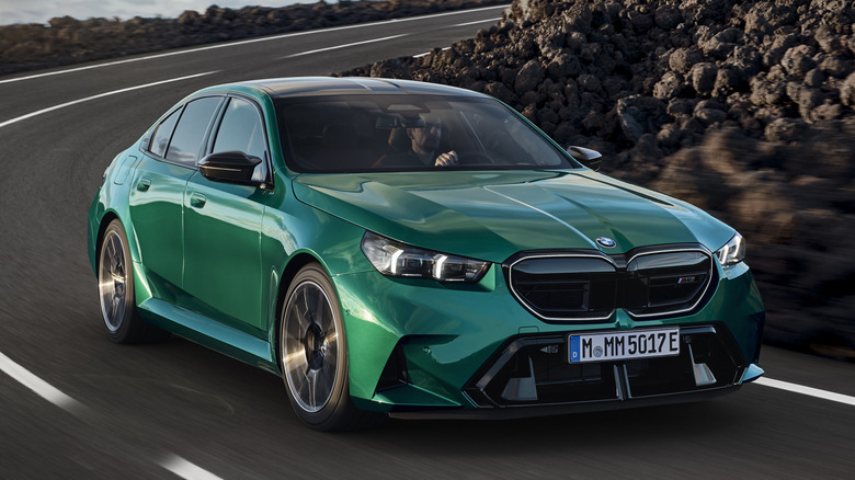 Green BMW M5 in motion