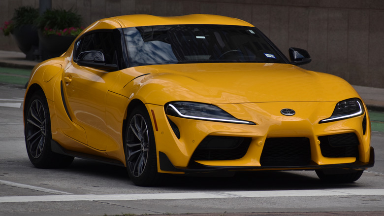A yellow Toyota Supra