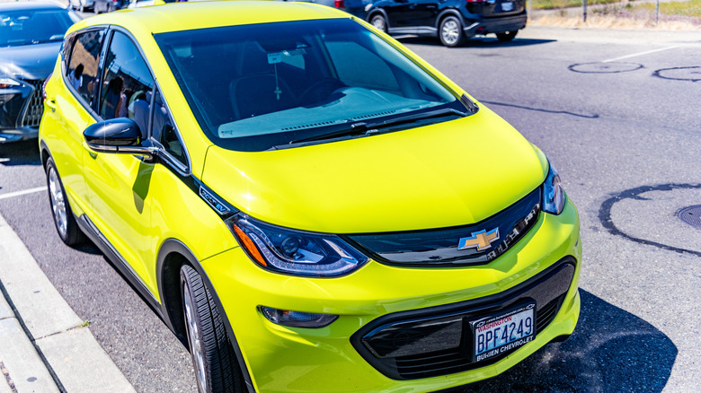 Lime green Chevy Bolt EV in parking lot