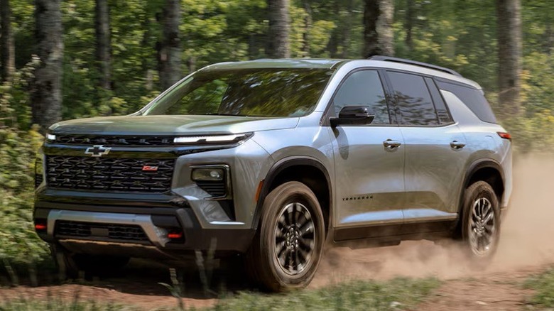2026 Chevrolet Traverse driving through forest